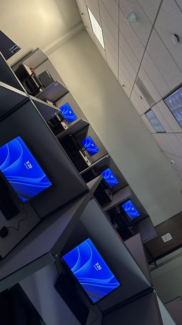 A row of desks all showing working desktop screens after the fix