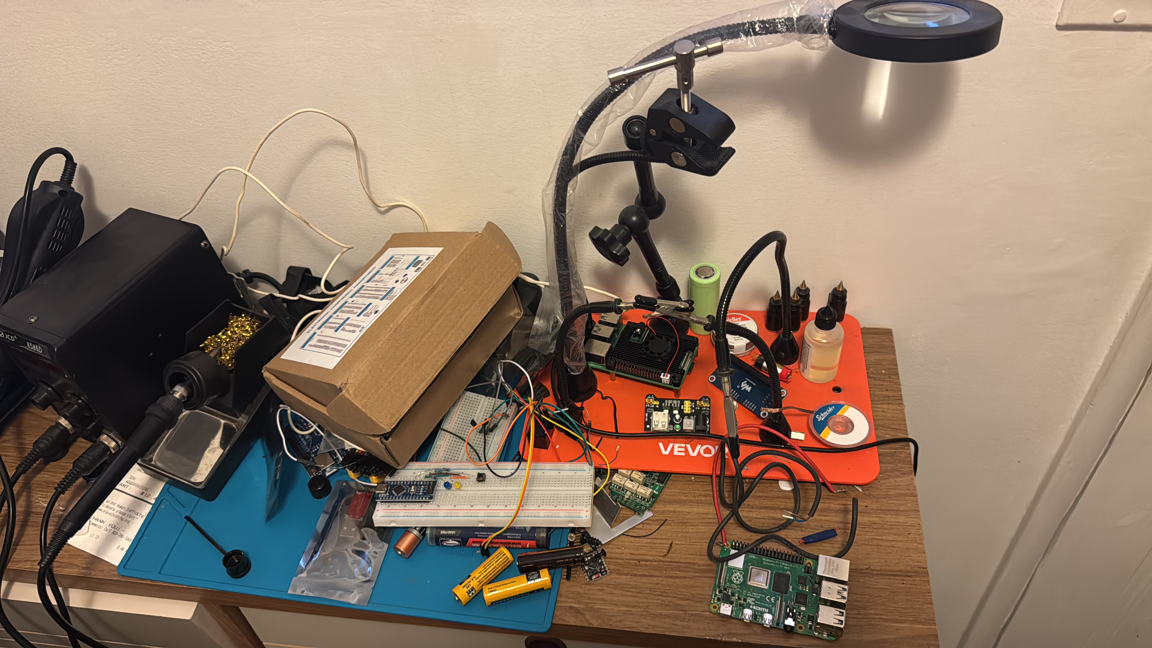 Lab workbench with Raspberry Pi, ESP32, and soldering station